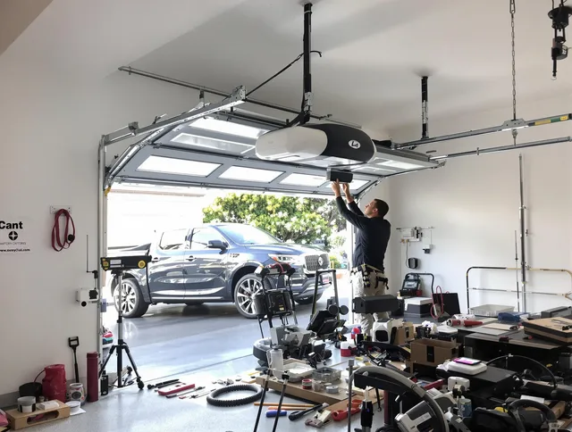 Boca Raton Garage Door Repair specialist installing smart garage door opener system in Boca Raton home